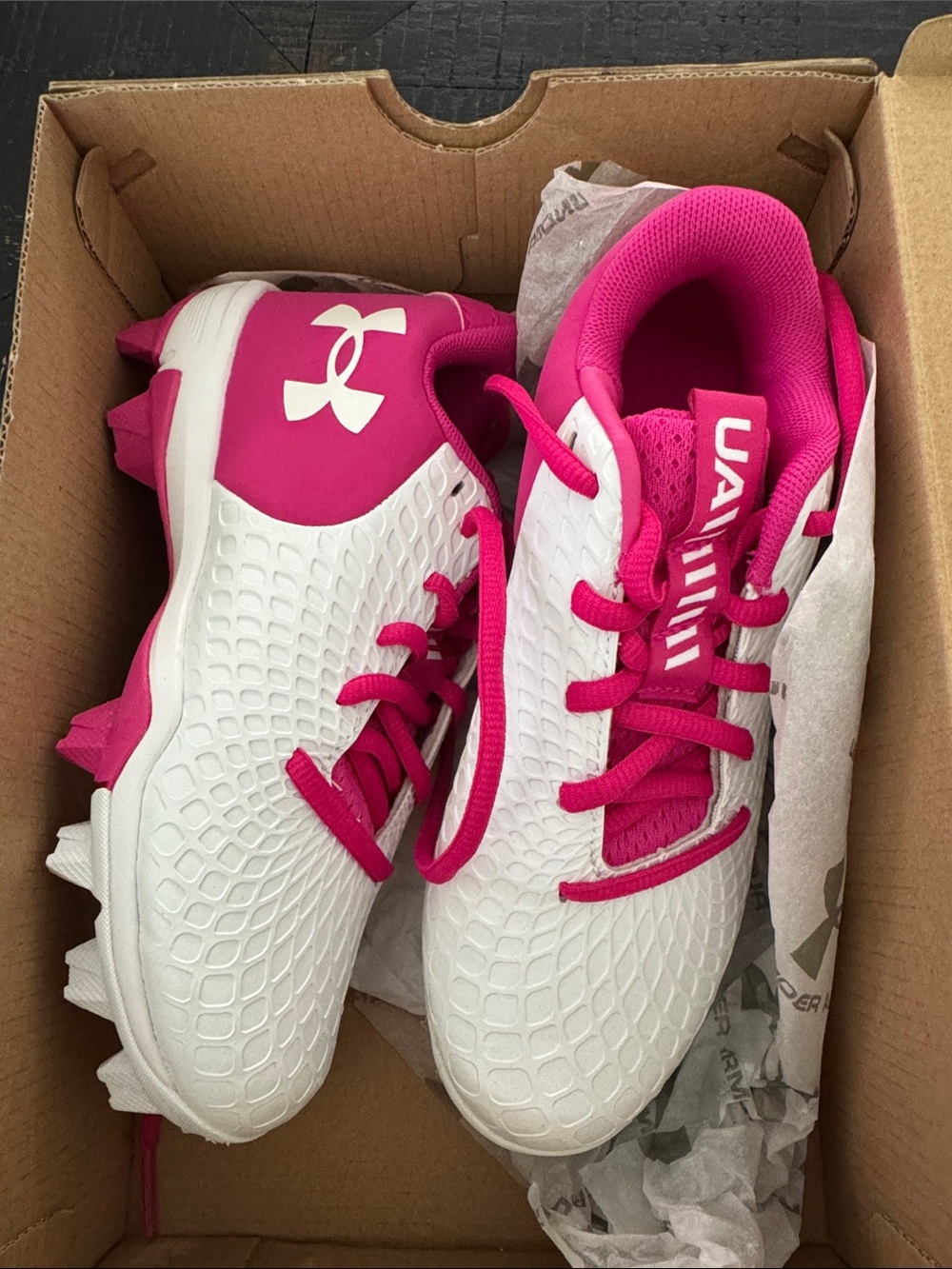 Under Armour Kid’s White and Pink Athletic Cleats